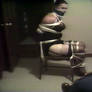 A Hopelessly Captive Dolly Sits Roped and Gagged