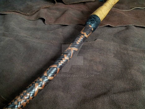 Fancy bullwhip with a wooden handle
