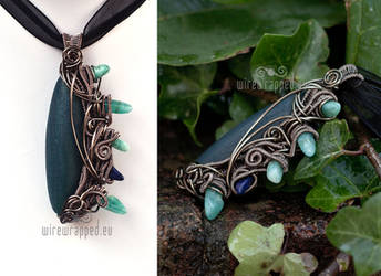 Blue reptilian pendant