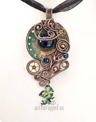 Steampunk pendant with a dragon charm