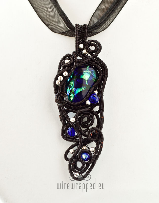 Blue black and green artifact pendant