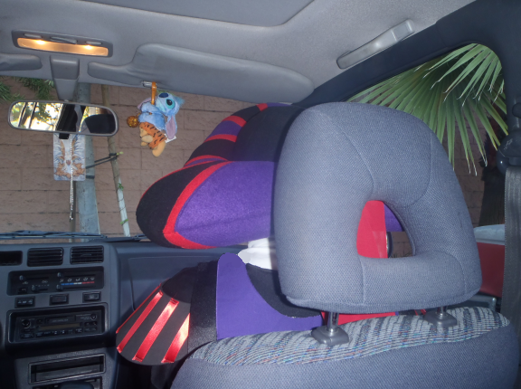 Frollo sits in the car