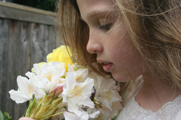 Girl Smelling Flowers 1