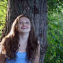 Laughing Girl Against Tree