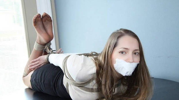 Carol P hogtied and tapegagged