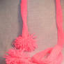 bright pink pom pom scarf