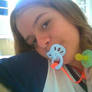 Girl with two pacifiers.