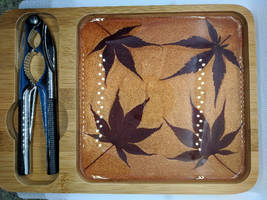 Wooden tray with nutcracker and Maple leaves