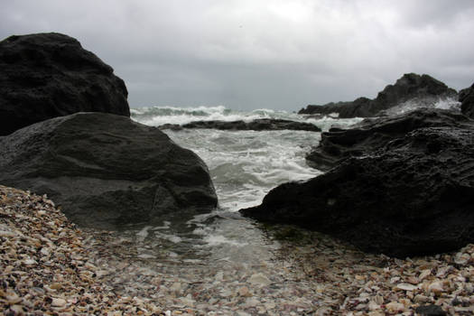 Shells, rocks and surf