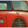 Hood Ornament and Fender Badge On A Ford 85 Truck