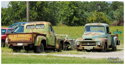 Two Old International Harvestor Pickup Trucks