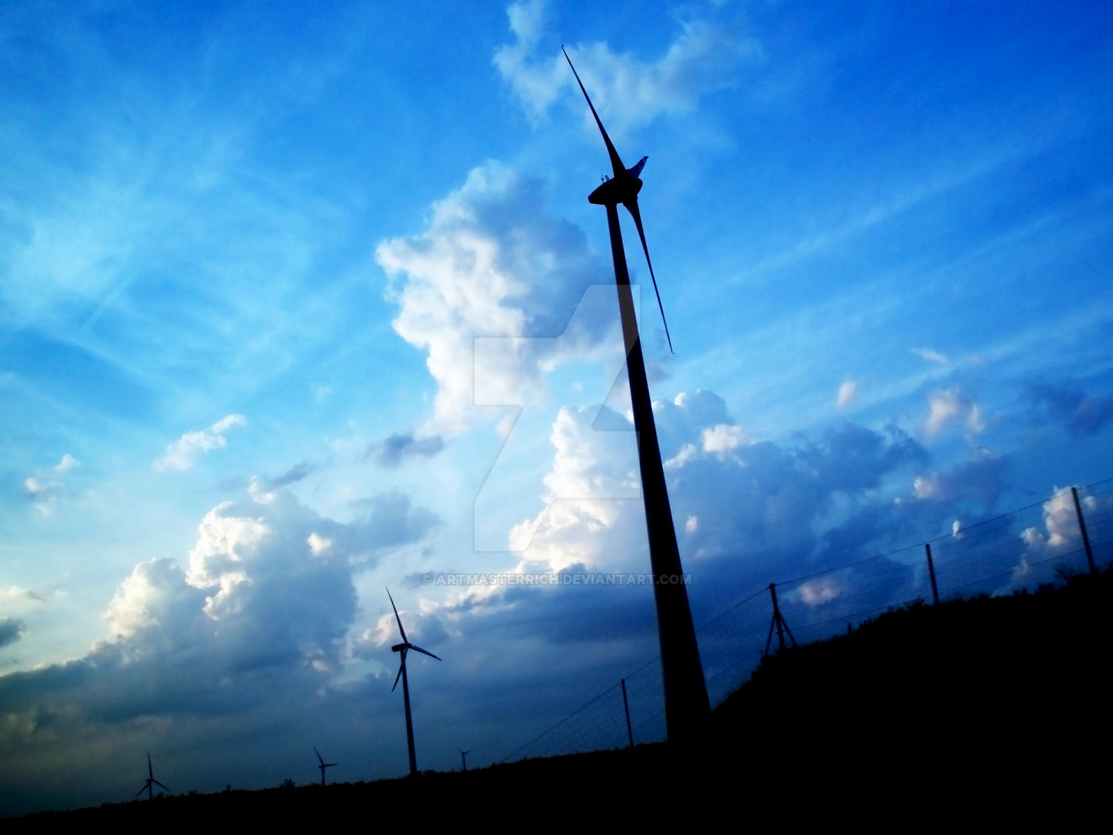 Windmills by Blue Sky