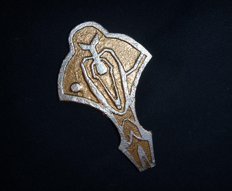 cardassian_union_insignia_badge_thing_by_amybalot_d6i1ga0-fullview.jpg?token=eyJ0eXAiOiJKV1QiLCJhbGciOiJIUzI1NiJ9.eyJzdWIiOiJ1cm46YXBwOjdlMGQxODg5ODIyNjQzNzNhNWYwZDQxNWVhMGQyNmUwIiwiaXNzIjoidXJuOmFwcDo3ZTBkMTg4OTgyMjY0MzczYTVmMGQ0MTVlYTBkMjZlMCIsIm9iaiI6W1t7ImhlaWdodCI6Ijw9NjE4IiwicGF0aCI6IlwvZlwvMTNiMjAxNWMtZTI1ZC00ZDZkLTk4OTQtZGI2MTYxMmViN2ZhXC9kNmkxZ2EwLWVhM2UxMjk0LTQ1NWQtNDUzNy1iMjZmLTk5ZmMxODIwZmVkYy5qcGciLCJ3aWR0aCI6Ijw9NzUwIn1dXSwiYXVkIjpbInVybjpzZXJ2aWNlOmltYWdlLm9wZXJhdGlvbnMiXX0.eHdODtkEMs2oP9TU179F5ifOM_sII-tacgmU25wtCA8