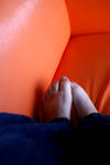 shy feet on an orange couch by kinkyfeat