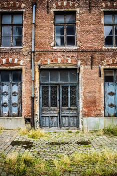 Old Building Blue Door Brick Wall and Brick Road