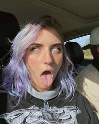 Purple-haired woman eyerolling ahegao with tongue