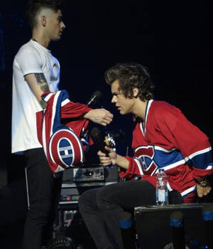 Zayn and Harry holding there mic