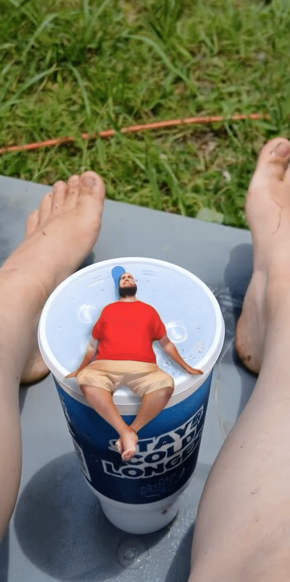 Sitting on Ashleys cup taking in your new size
