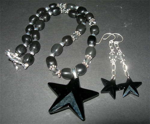 Black Star Necklace by fieryfae
