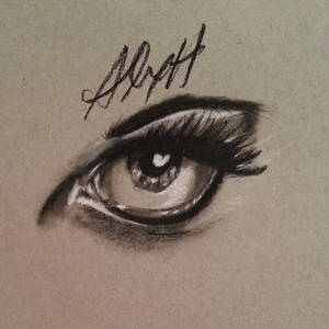 Eye sketch (black/white charcoal on toned paper)