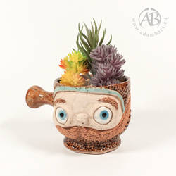 Small ceramic mug or planter with funny face