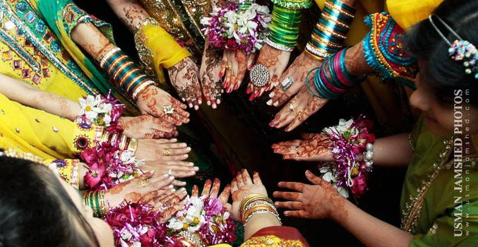 Pakistani Women wearing mehndi in a local wedding