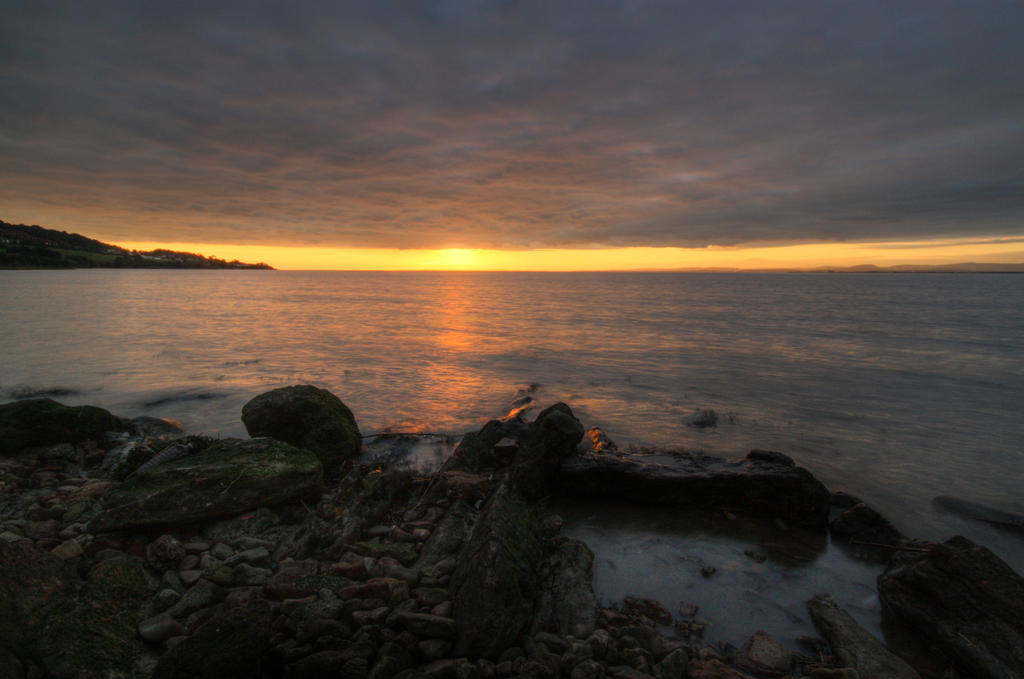 Sunset rocks and sea stock