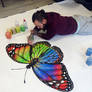 Butterfly made with color sand