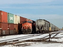 Intermodal passing a parked train