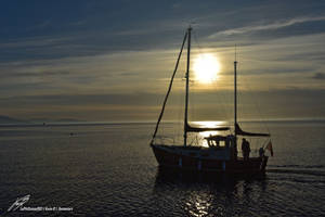 Bateau devant le Coucher de Soleil