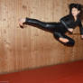 Flying side kick in leather