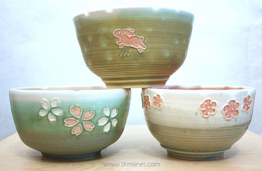 Bowls with flowers and one rabbit