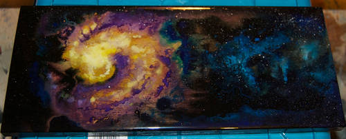 Galaxy on cherry wood