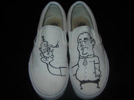 Shoe art: Man holding bean-fetus guy