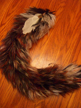 Wolf Tail with Feather and Charm