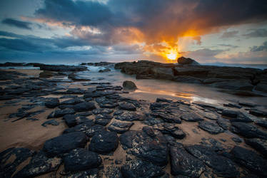 Sunrise on the Beach with some Rocks and Stuff