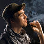 STOCK cuban man smokes