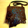 Brown messenger bag with a floral design