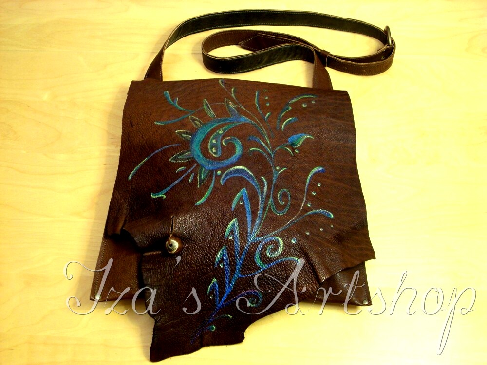 Brown messenger bag with a floral design