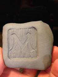 Stamp In Clay From A Woodcarving I Made