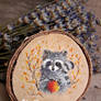 Miniature raccoon painting on wood