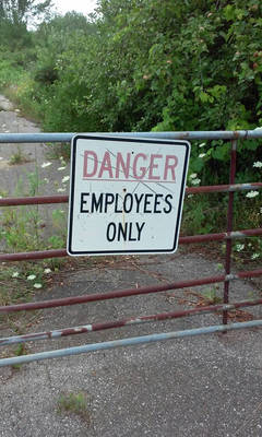 Danger Sign On Rusty Gate