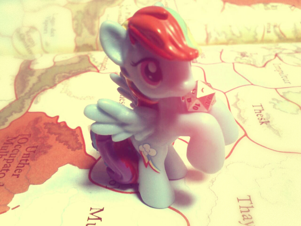 Rainbow Dash is rolling a dice