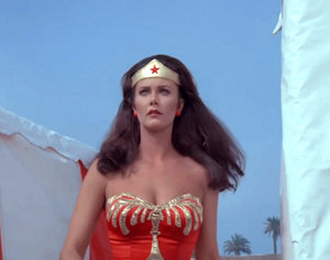 Wonder Woman overpowers a man at the beach