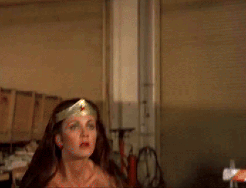 Wonder Woman putting two henchmen to sleep