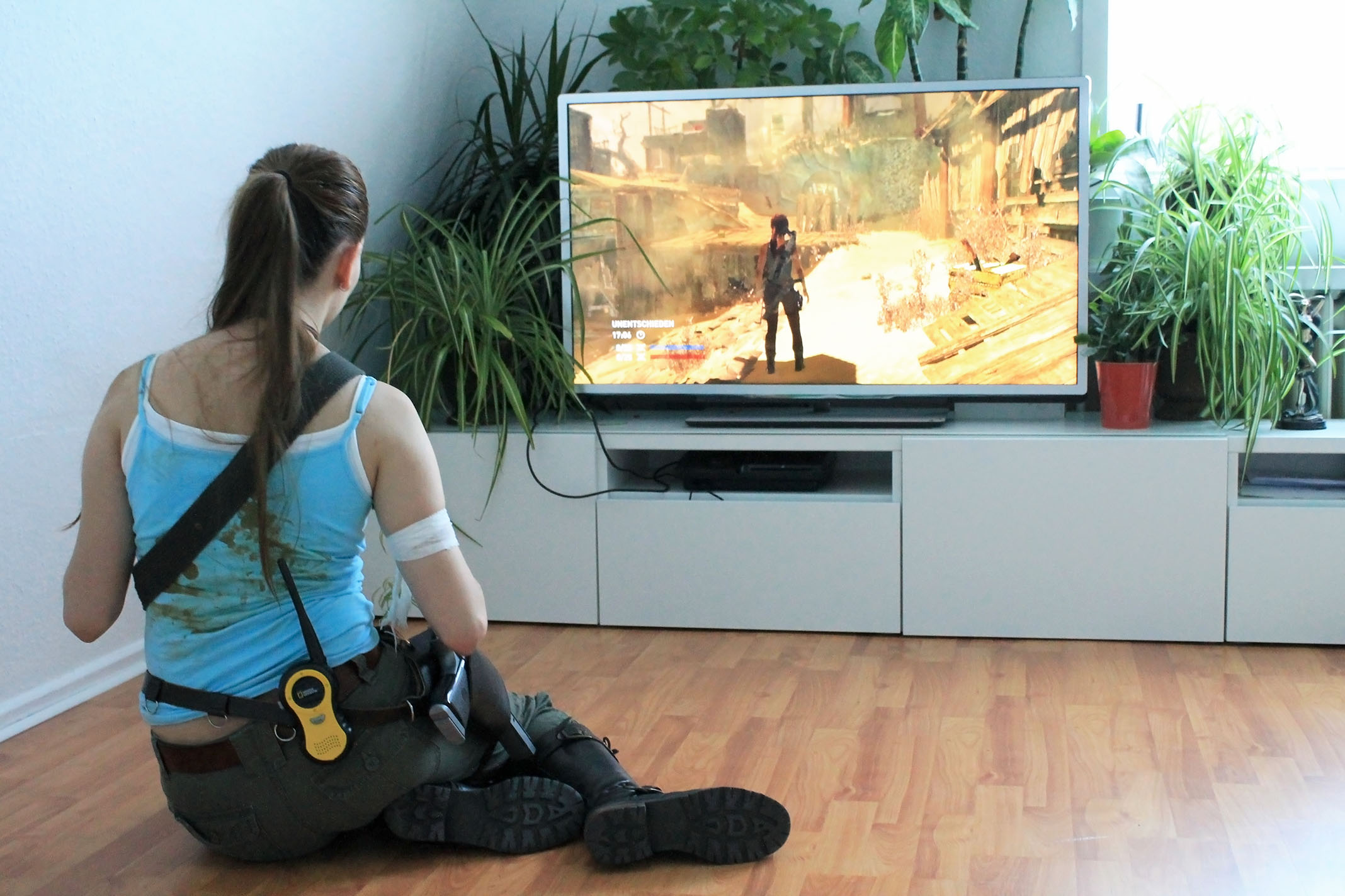 Lara Croft playing the Tomb Raider game