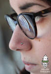 Fresh nostril with titanium and opal jewelry