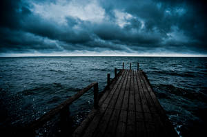 Dark Wooden Pier by tuebengtsson