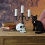 Miniature Black Cat and skull sculptures