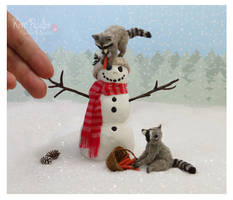 Winter shenanigans raccoon sculptures